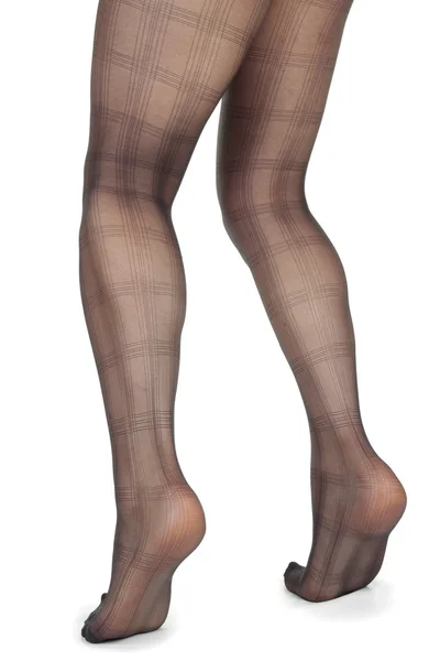 Weibliche Beine tragen geblümte Leggings und High Heels über weißem Backgro — Stockfoto