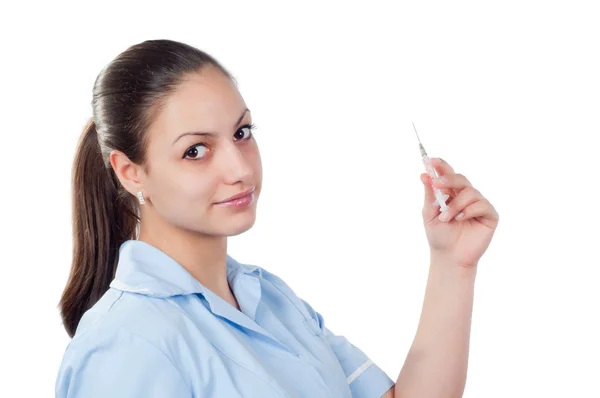 Beautiful young nurse holding injection isolated on white — Stock Photo, Image
