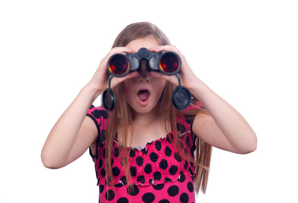 Surprised teenage girl watching something with binoculars isolated on white