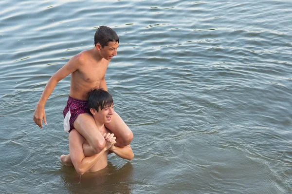 Two teenage boys having fun in the river — Stock Photo, Image