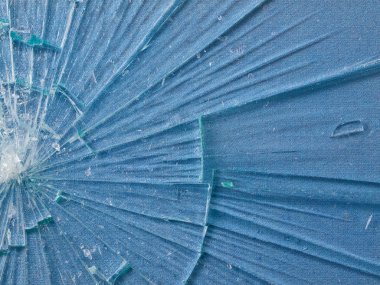 Cracked Glass Macro with a Sky Blue Patterned Background clipart