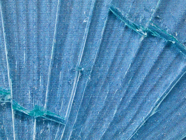 Cracked Glass Macro with a Sky Blue Patterned Background — Stock Photo, Image