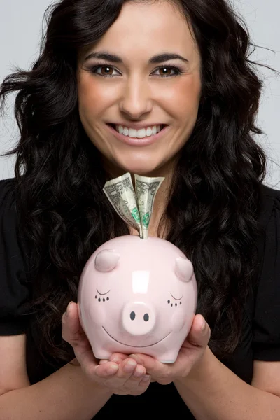 Mulher colocando segurando Piggy Bank — Fotografia de Stock