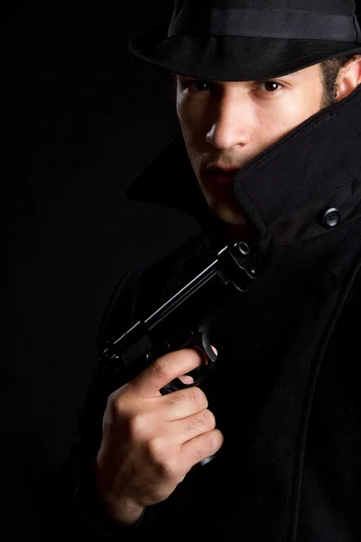 Człowiek gospodarstwa pistolet — Zdjęcie stockowe