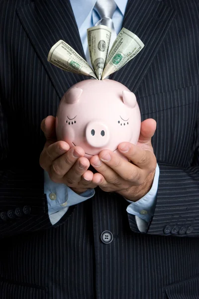 Empresario Holding Piggy Bank —  Fotos de Stock