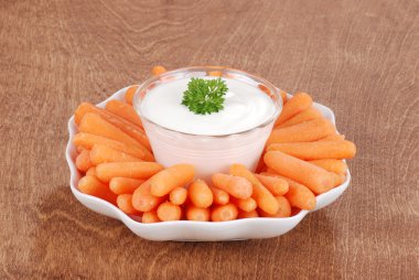 Baby Carrots with ranch dressing dip clipart
