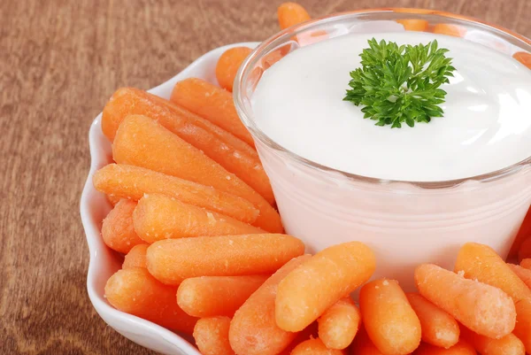 Closeup carrots with salad dip focus on parsley — Stock Photo, Image