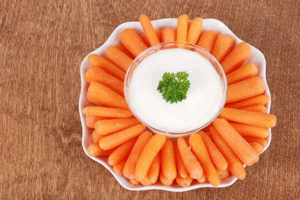 Top view carrots with salad dip — Stock Photo, Image