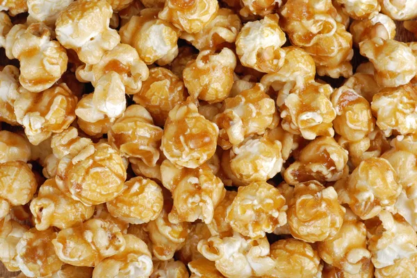 Karamel snoep popcorn achtergrond — Stockfoto