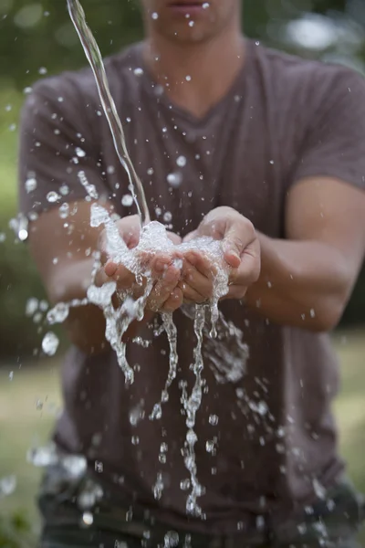 Man Catching Water — Stock Photo, Image