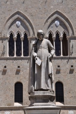 Statue, Salimbeni square in Siena clipart