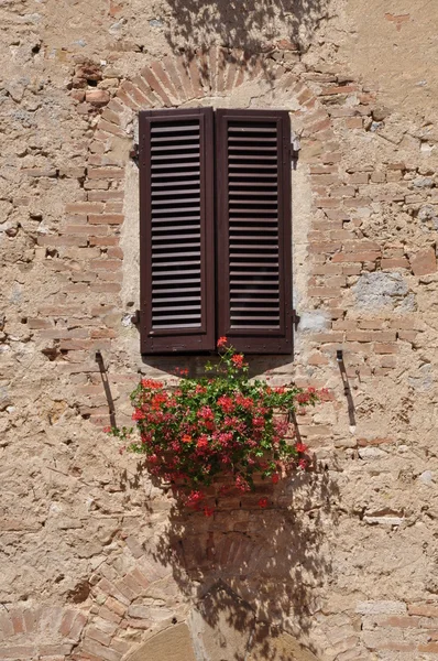 Closed window on a stone wall, a symbol of refuge — Stock Photo, Image
