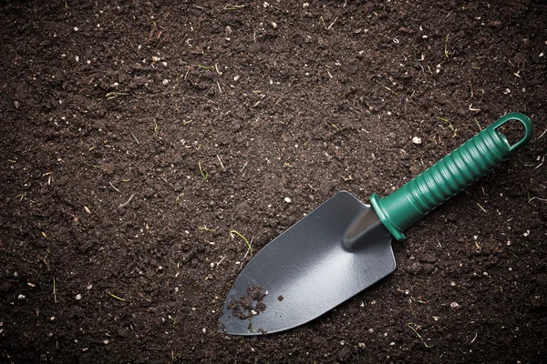 Soil with shovel — Stock Photo, Image