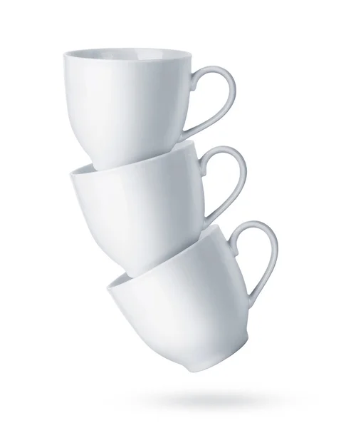 Чашки белого кофе на белом фоне — стоковое фото