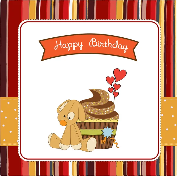 Birthday greeting card with cupcake and puppy toy — Stock Photo, Image