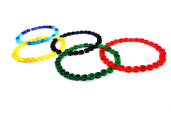 Juegos Olímpicos símbolo de color tapas de plástico —  Fotos de Stock