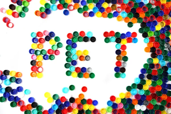 Palabra PET de tapas de plástico de color — Foto de Stock