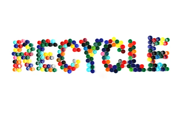 Palavra reciclar de tampas de plástico de cor — Fotografia de Stock