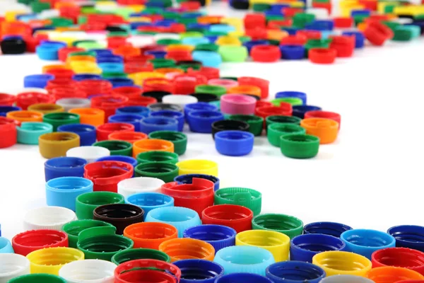 Tapas de color de plástico fondo — Foto de Stock
