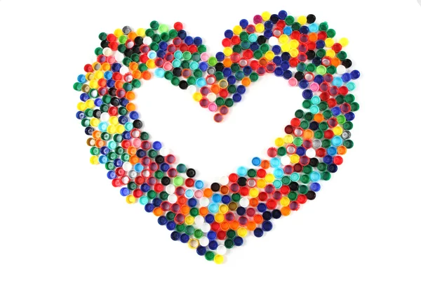 Renkli plastik kapaklar yürekten — Stok fotoğraf
