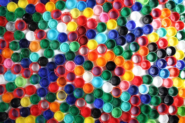 Tampas de cor como fundo de plástico — Fotografia de Stock