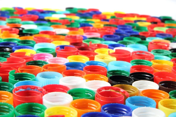 Tappi di colore come sfondo di plastica — Foto Stock