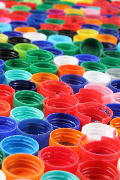 Tappi di colore come sfondo di plastica — Foto Stock