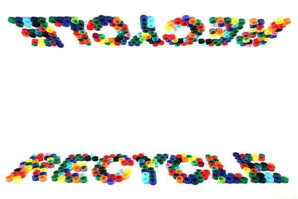 Переработка символов из цветных колпачков — стоковое фото