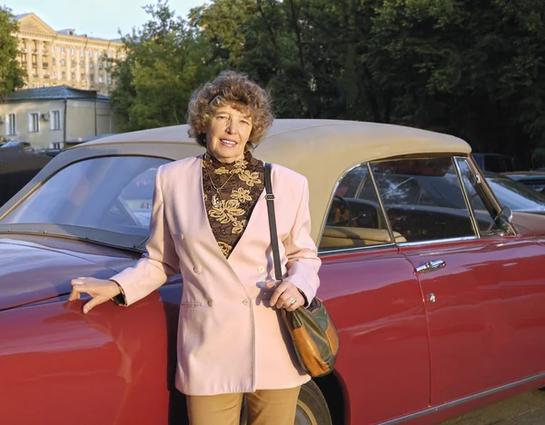 stock image Mature woman near car