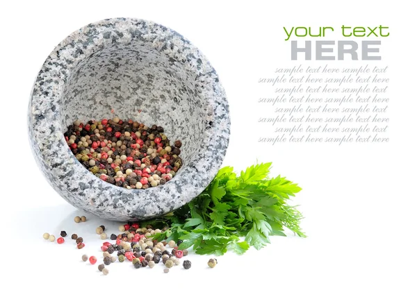 Stone mortar with mixture of peppers and greenery of parsley — Stock Photo, Image