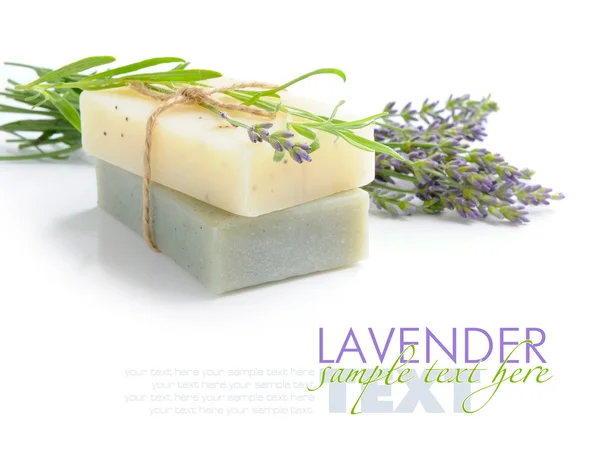 Handmade soap and lavender flowers on a white background — Stock Photo, Image