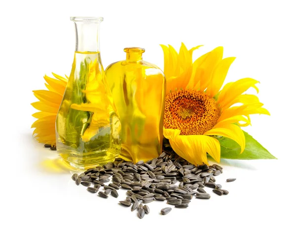Sonnenblumenöl mit Blüte und Samen auf weißem Hintergrund — Stockfoto