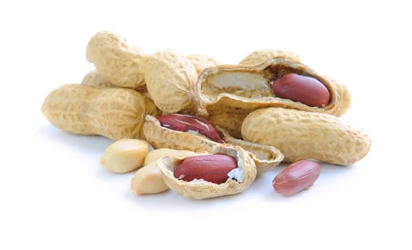 Komposition aus Erdnüssen auf weißem Hintergrund — Stockfoto