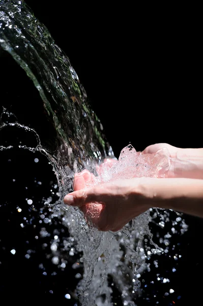 Woman hands with water splash — Stock Photo, Image