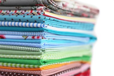 Pile of colorful cotton textile background clipart