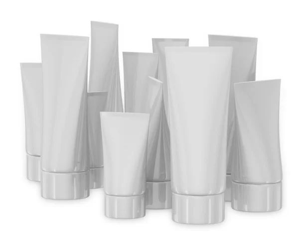 Tubos cosméticos brancos no fundo branco — Fotografia de Stock