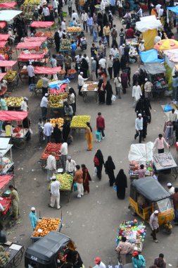 People shopping in the street market near charminar,Hyderabad,India during Ramzan festival clipart