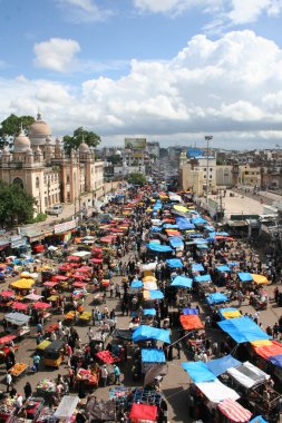 People shopping in the street market near charminar,Hyderabad,India during Ramzan festival clipart