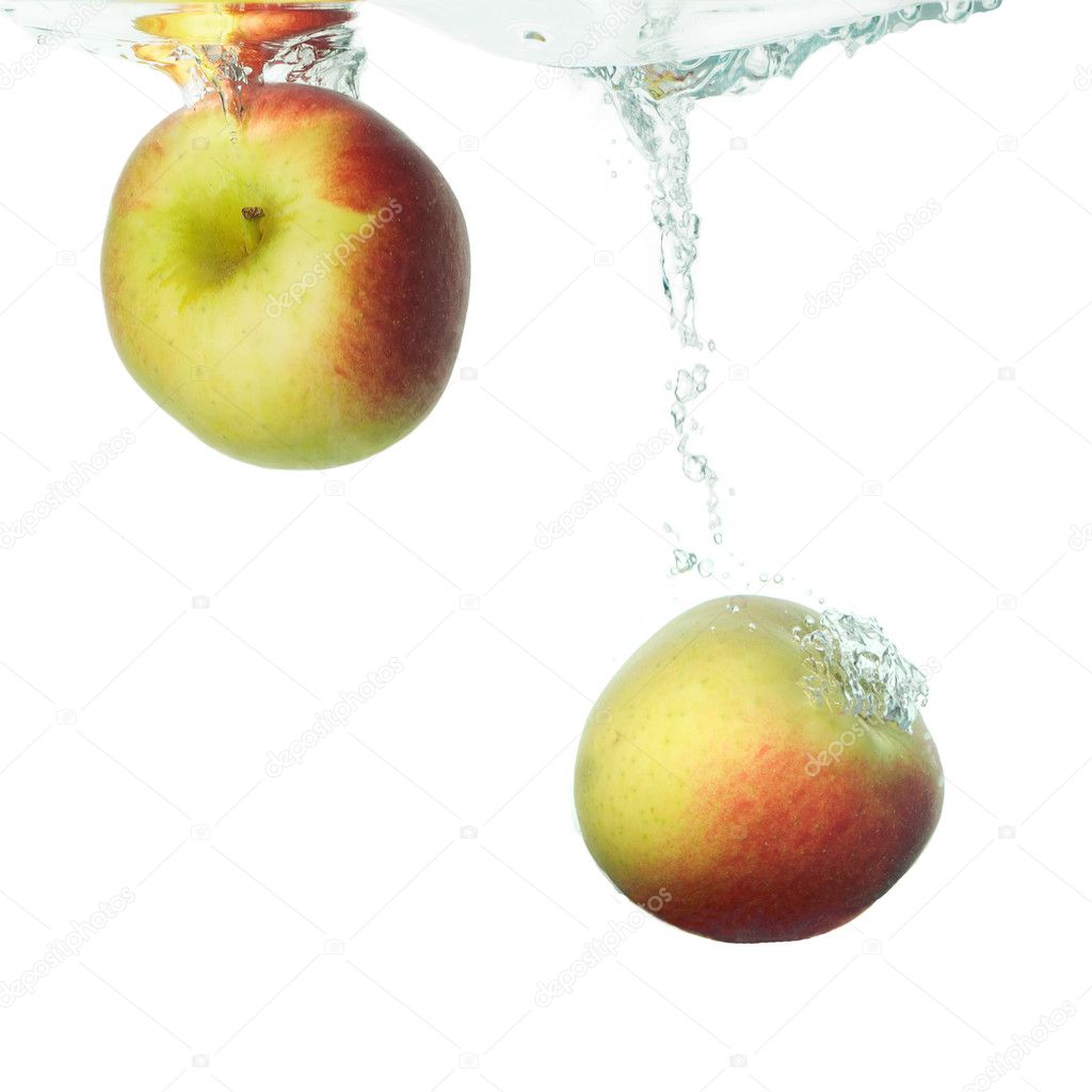 Two apples falling in water