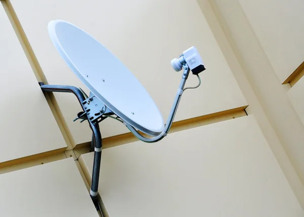 stock image Satellite dish on a wall