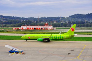 Boeing-737-800, passenger airliner of S7 airlines («Siberia») on the platform of the International Sochi airport on August 16, 2012 in Sochi, Russia