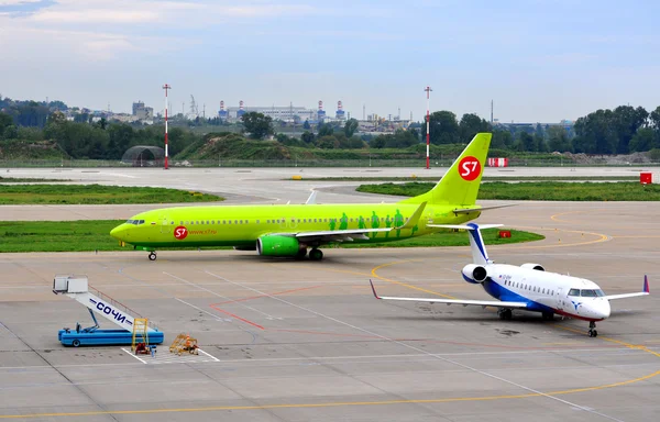 stock image Рassenger airliners on the platform of the International Sochi airport on August 16, 2012 in Sochi, Russia