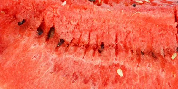 Czerwony soczysty arbuz jako tło — Zdjęcie stockowe