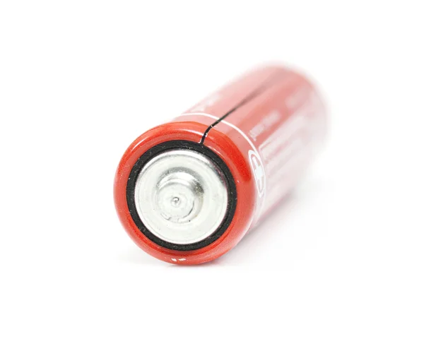 Red battery macro on white background — Stock Photo, Image