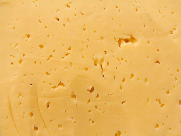 鲜黄色瑞士奶酪带孔的背景 — 图库照片
