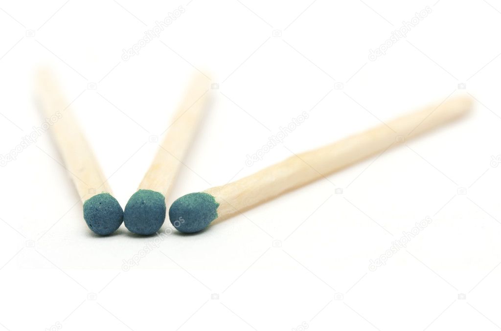 Three green match on a white background