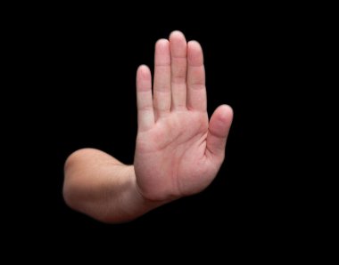 Hand on a black background. stop clipart