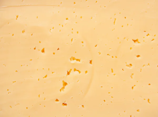 Achtergrond van verse gele Zwitserse kaas met gaten — Stockfoto