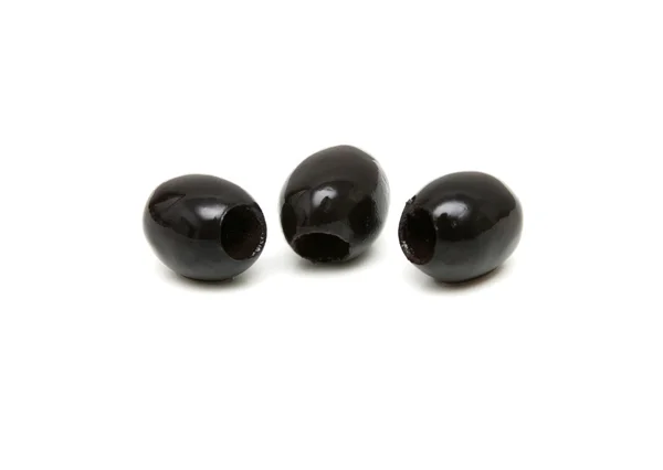 Three black olives shot on white background — Stock Photo, Image