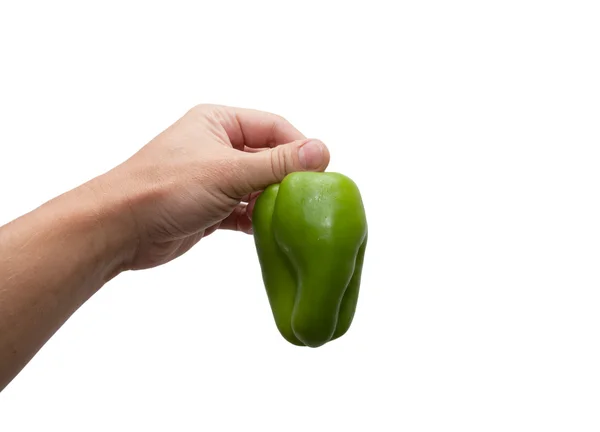 Green bell pepper in hand — Stok fotoğraf